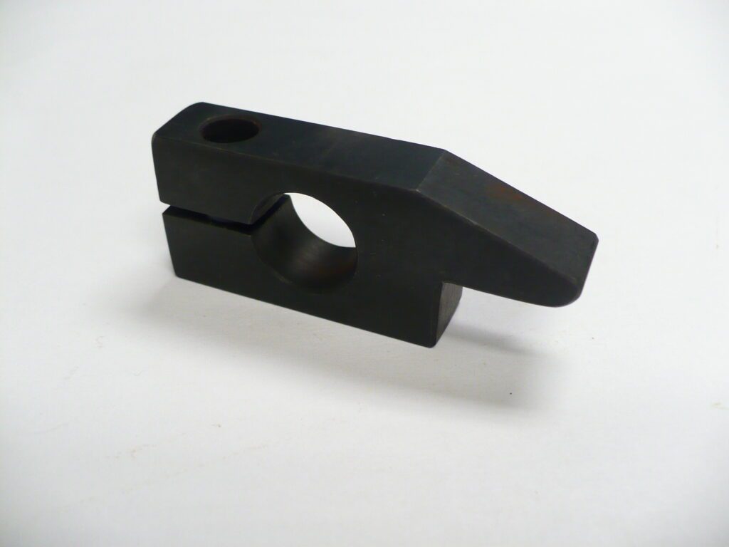 A black Latch Stroke Stop technical part