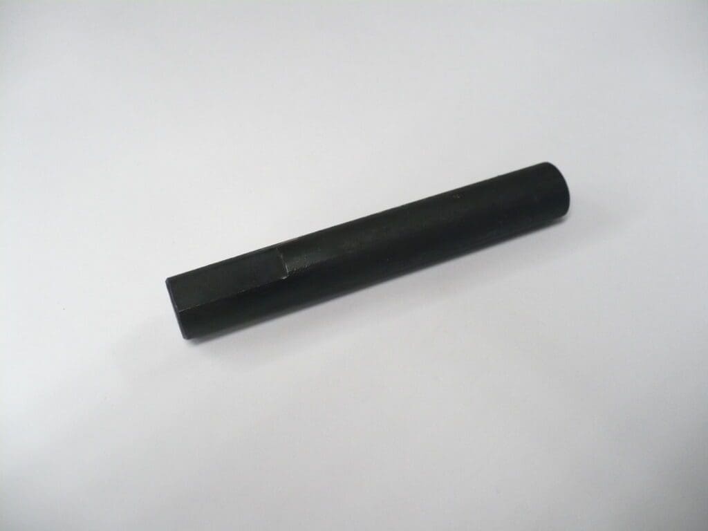 Black metal cylindrical rod on white background